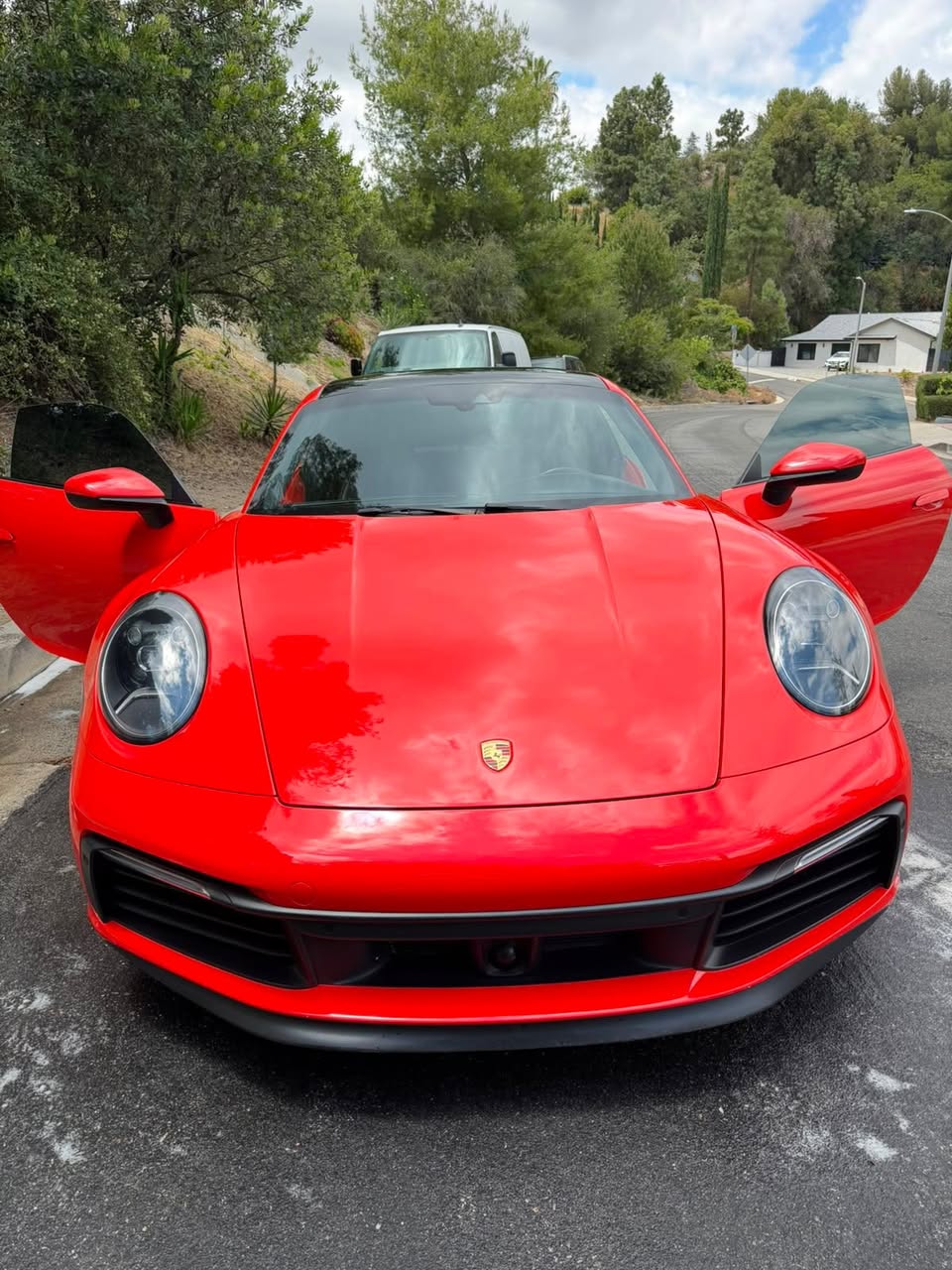 Red Porsche 911 with mirror-gloss paint after a mobile detail